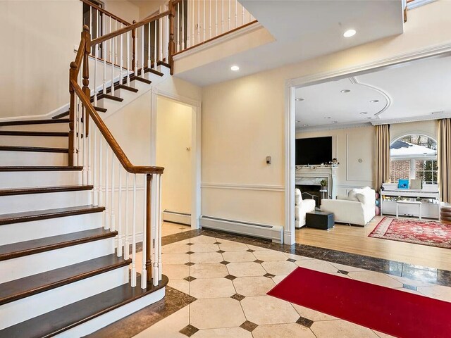 25 Pine Glen Dr, Blauvelt, NY 10913 - staircase with a baseboard radiator, baseboards, a fireplace, and recessed lighting