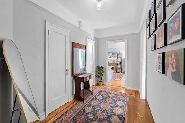 corridor with light wood finished floors