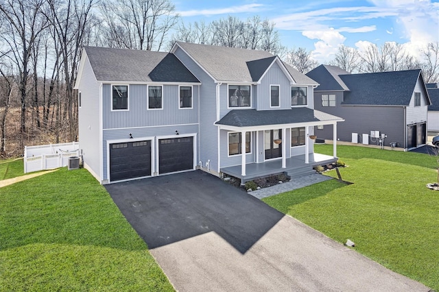 view of front of house with aphalt driveway, a porch, an attached garage, and a shingled roof