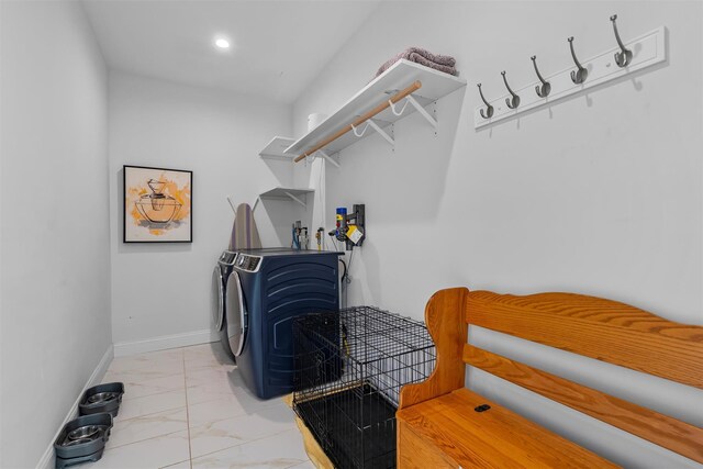 clothes washing area featuring baseboards, washing machine and dryer, laundry area, recessed lighting, and marble finish floor