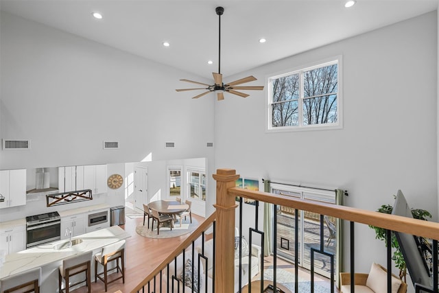 interior space featuring recessed lighting, visible vents, and a sink