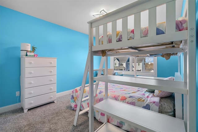 carpeted bedroom with baseboards