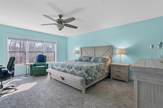 bedroom featuring baseboards, a ceiling fan, and carpet flooring