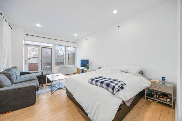 bedroom with light wood-type flooring and recessed lighting