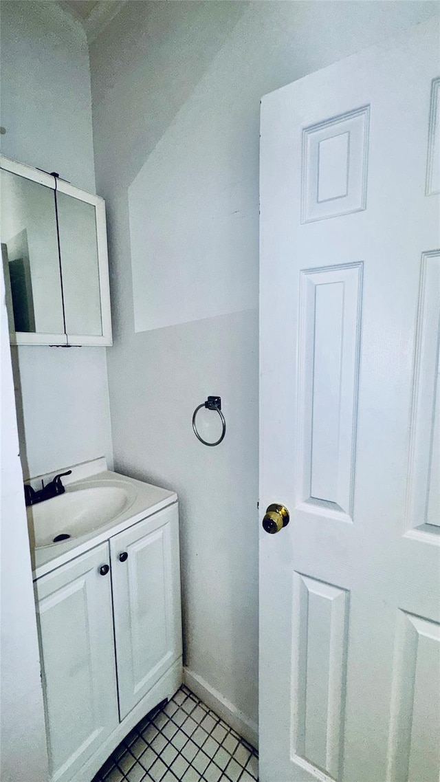 10634 Sutphin Blvd, Jamaica, NY 11435 - bathroom featuring tile patterned flooring, vanity, and baseboards