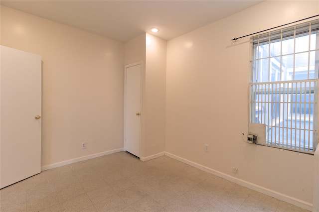 10634 Sutphin Blvd, Jamaica, NY 11435 - empty room featuring tile patterned floors, baseboards, and recessed lighting