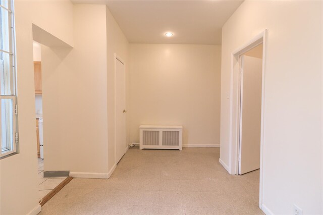 10634 Sutphin Blvd, Jamaica, NY 11435 - hallway with radiator heating unit and baseboards
