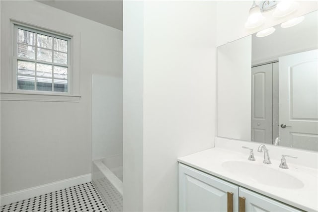 bathroom featuring tile patterned floors, vanity, and baseboards