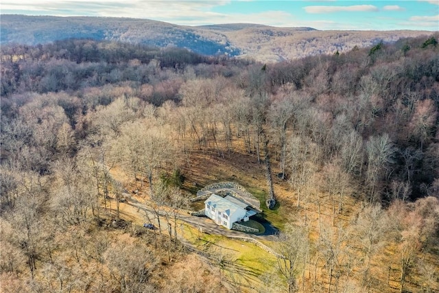 bird's eye view with a wooded view and a mountain view