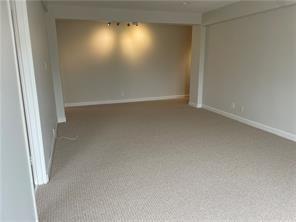 unfurnished room featuring baseboards