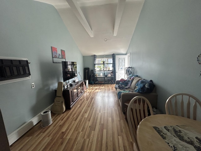 living area featuring high vaulted ceiling, beam ceiling, baseboards, and wood finished floors