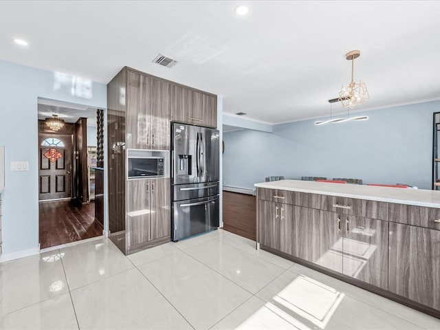 kitchen featuring light tile patterned floors, a baseboard radiator, visible vents, modern cabinets, and stainless steel fridge with ice dispenser