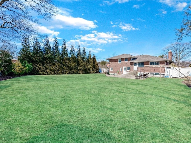 view of yard featuring a patio area and fence