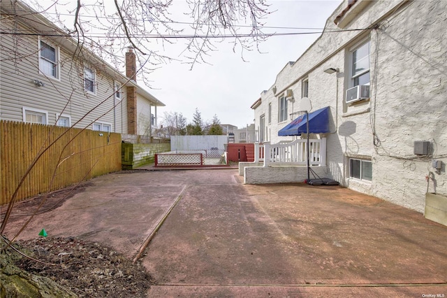 view of yard with fence and cooling unit