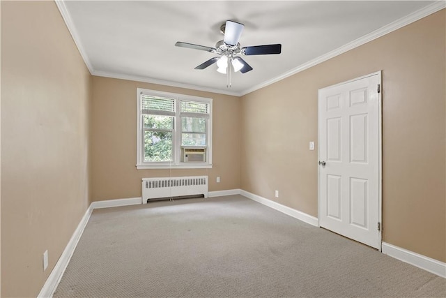 unfurnished room with ornamental molding, radiator, carpet, baseboards, and ceiling fan