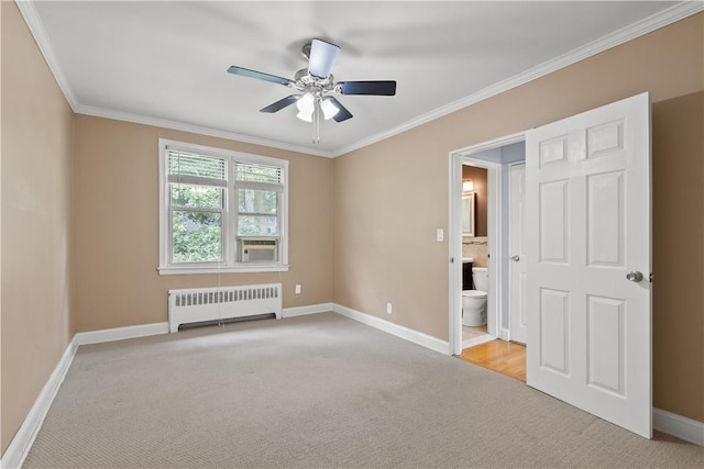 unfurnished bedroom featuring crown molding, baseboards, radiator heating unit, light carpet, and ensuite bath