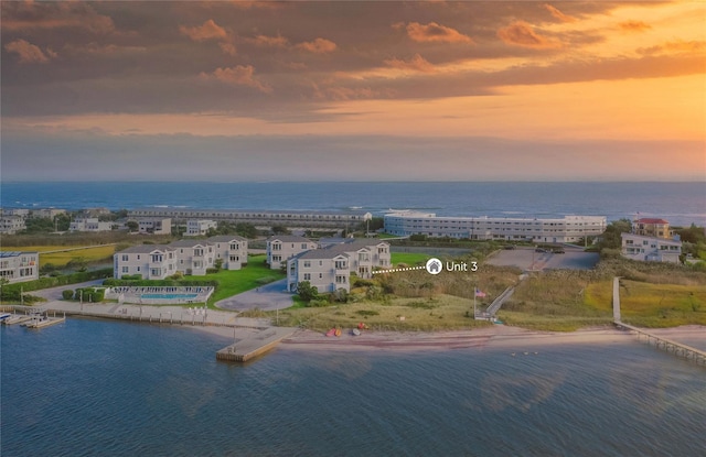 aerial view at dusk with a water view