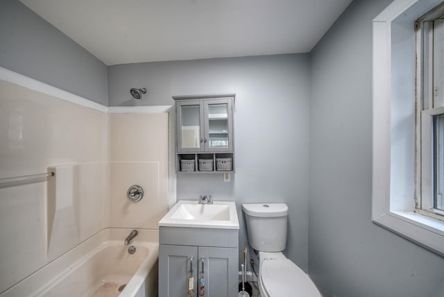 full bathroom featuring toilet, vanity, and bathing tub / shower combination