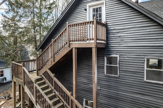 view of side of property with a deck and stairway