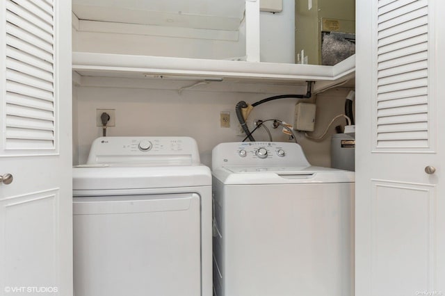 clothes washing area featuring laundry area and washing machine and dryer