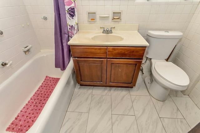 bathroom with shower / bathtub combination with curtain, toilet, marble finish floor, tile walls, and vanity