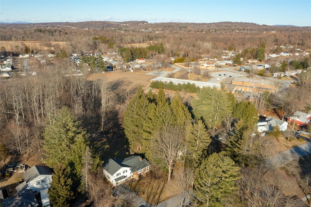 bird's eye view featuring a forest view