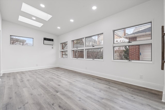53-31 212th St, Bayside, NY 11364 - empty room with a skylight, healthy amount of natural light, vaulted ceiling, wood finished floors, and recessed lighting