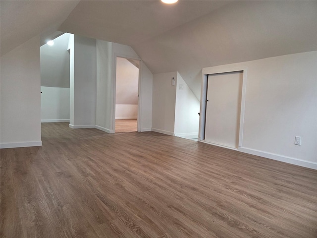 53-31 212th St, Bayside, NY 11364 - bonus room with wood finished floors, vaulted ceiling, and baseboards