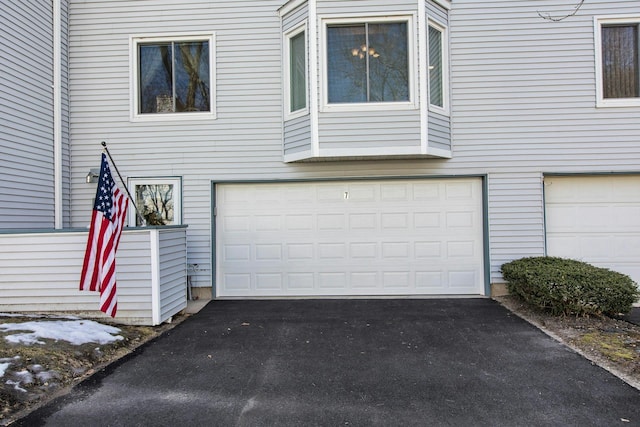 garage featuring driveway