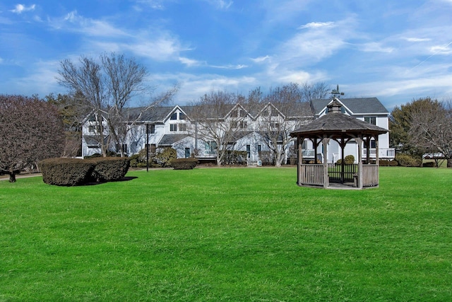 view of community with a yard and a gazebo