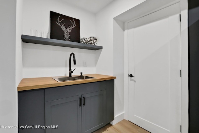 interior space featuring light wood-style flooring and a sink