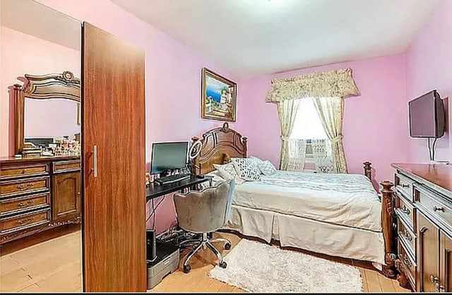 bedroom featuring wood finished floors