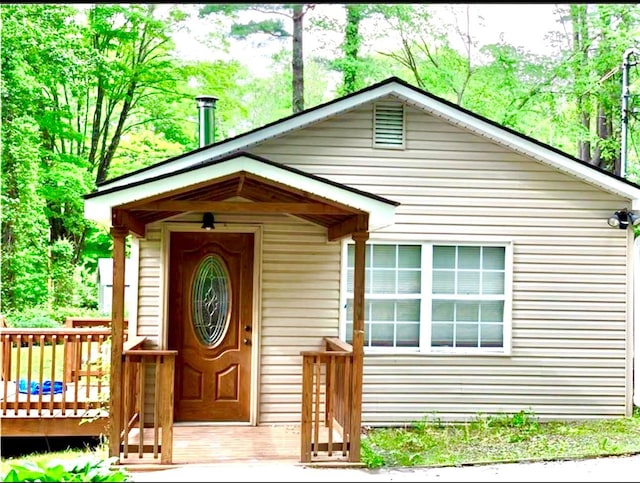 exterior space featuring a wooden deck