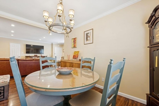 dining room featuring recessed lighting, crown molding, baseboards, and wood finished floors