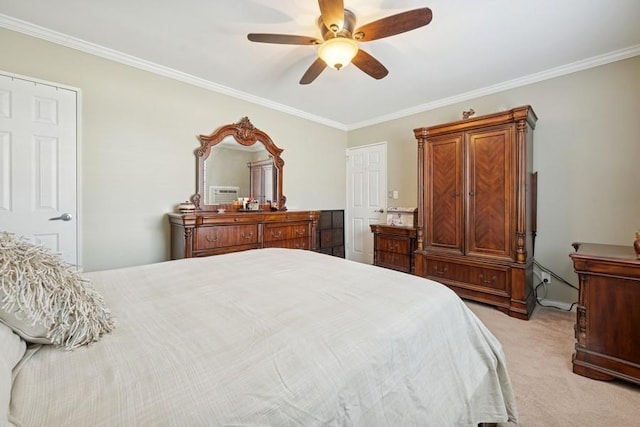 bedroom featuring ornamental molding, a ceiling fan, and light colored carpet