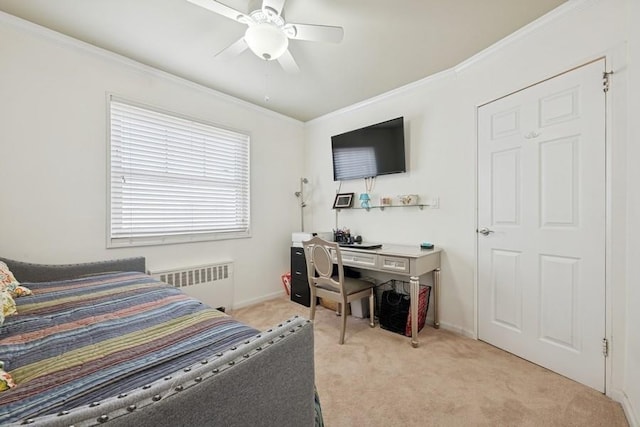 bedroom featuring ceiling fan, ornamental molding, light colored carpet, and radiator