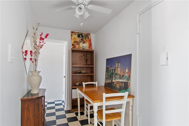 dining space featuring ceiling fan and tile patterned floors