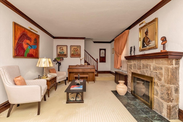 sitting room featuring stairs, crown molding, a fireplace, and baseboards