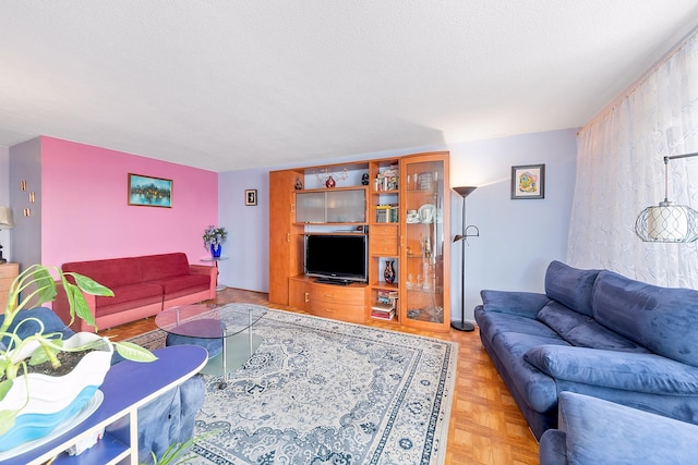 living area featuring a textured ceiling