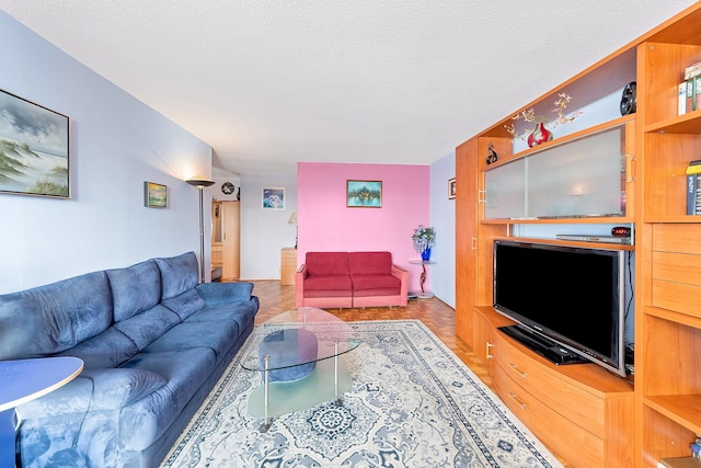 living area with a textured ceiling