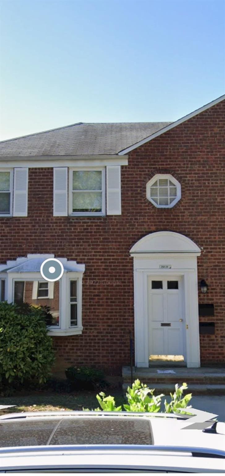 view of front of home featuring brick siding