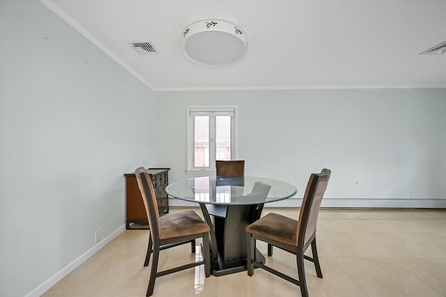 dining area with ornamental molding, baseboard heating, visible vents, and baseboards