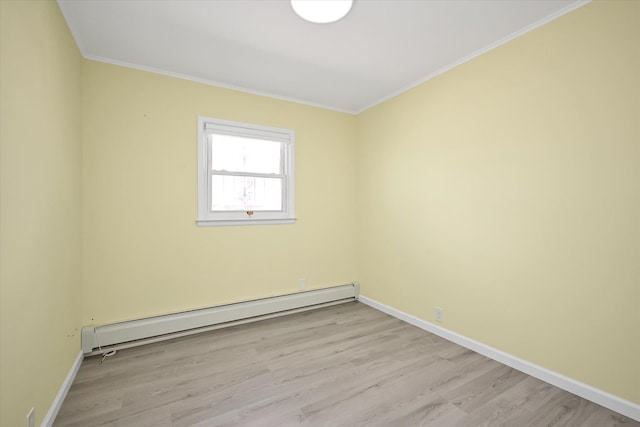 unfurnished room featuring crown molding, light wood finished floors, a baseboard radiator, and baseboards