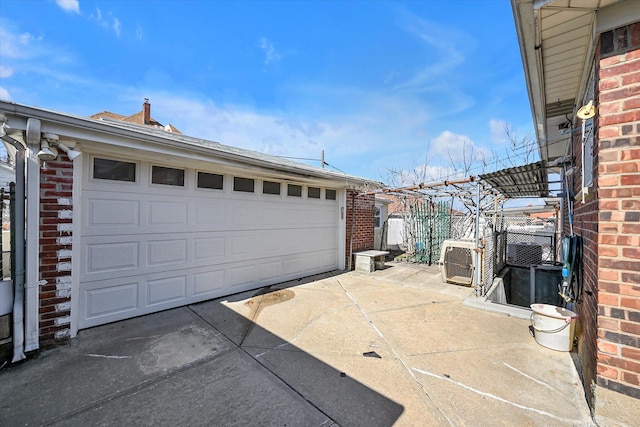 detached garage with ac unit and fence