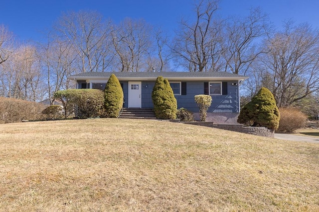 ranch-style home with a front lawn