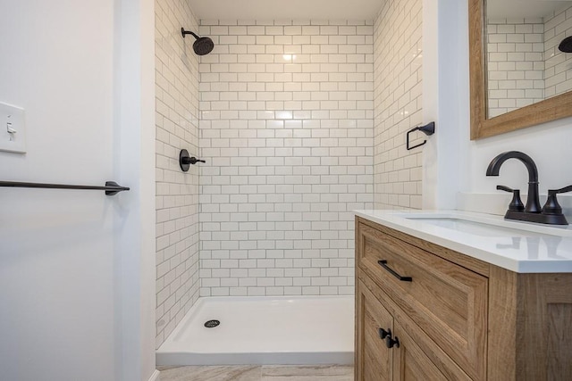 bathroom with vanity and a stall shower