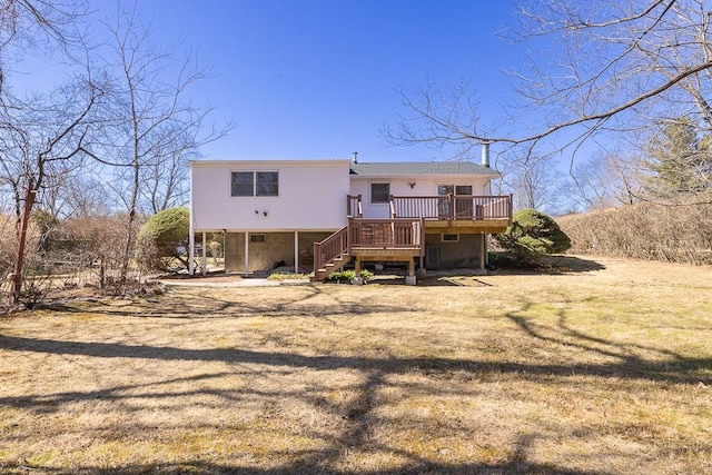 rear view of house with a wooden deck, stairs, a yard, and dirt driveway