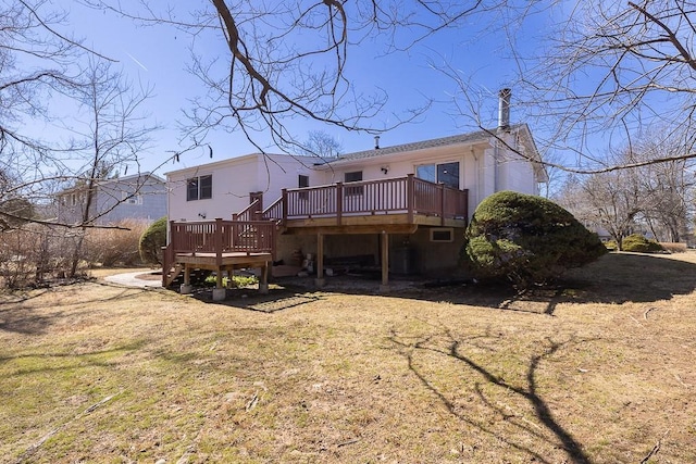 back of house featuring a deck