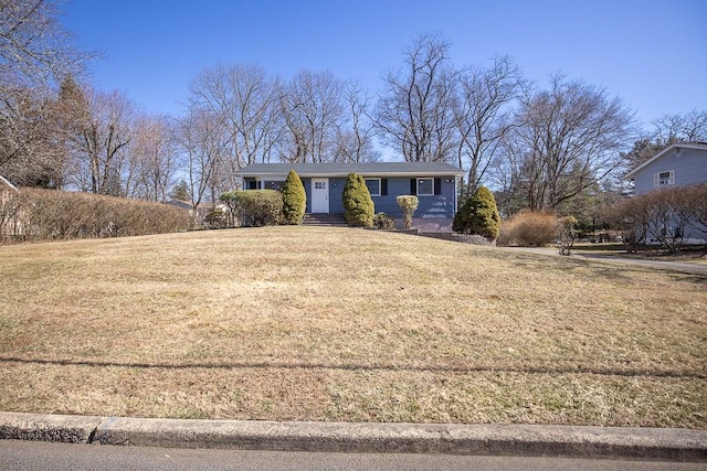 ranch-style home with a front lawn