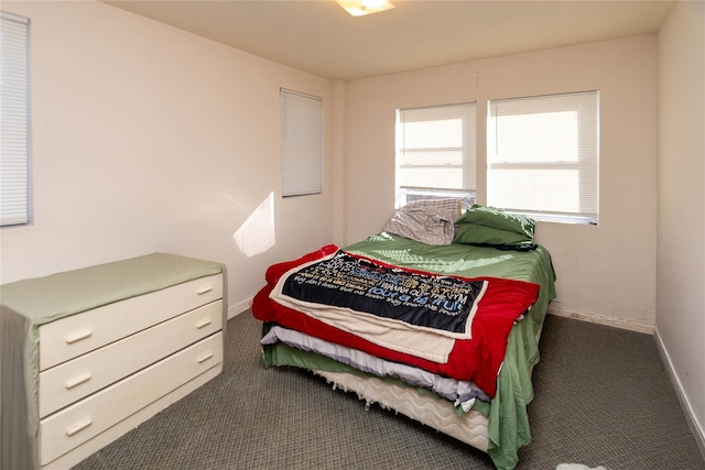 carpeted bedroom with baseboards